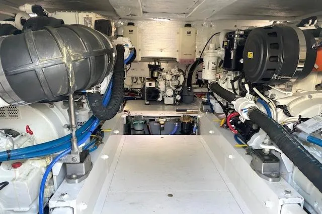 Slide: The Image of Engine room of 1988 Buddy Davis 47 Custom Carolina boat, showcasing mechanical components. - 28