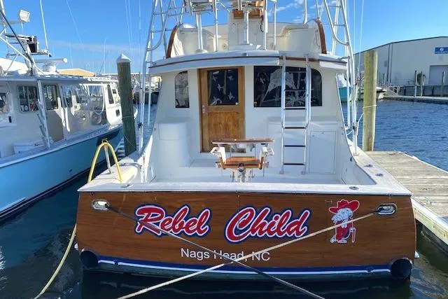 Slide: The Image of 1988 Buddy Davis 47 Custom Carolina boat docked, named "Rebel Child," Nags Head, NC. - 3