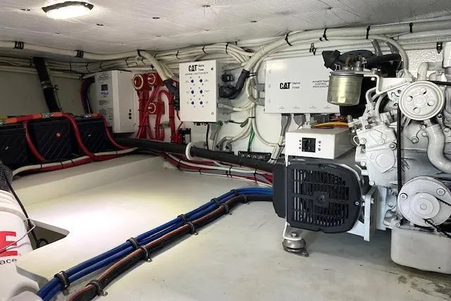 Slide: The Image of Engine room of 1988 Buddy Davis 47 Custom Carolina boat, featuring CAT machinery. - 32