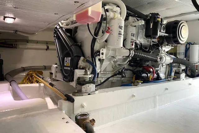 Slide: The Image of Engine room of 1988 Buddy Davis 47 Custom Carolina boat, featuring CAT machinery. - 34
