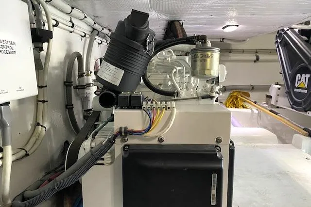 Slide: The Image of Engine room of 1988 Buddy Davis 47 Custom Carolina boat, showcasing mechanical components. - 35