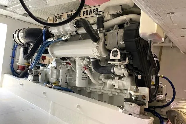 Slide: The Image of Engine room of 1988 Buddy Davis 47 Custom Carolina boat with CAT marine power. - 37