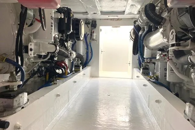 Slide: The Image of Engine room of 1988 Buddy Davis 47 Custom Carolina yacht, showcasing mechanical components. - 40