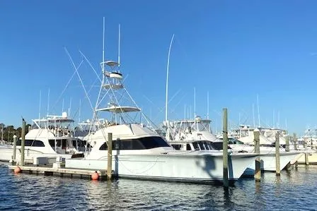 Slide: The Image of 1988 Buddy Davis 47 Custom Carolina yacht docked at marina under clear blue sky. - 43