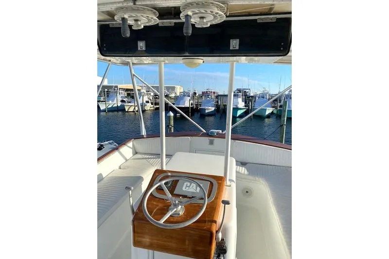 Slide: The Image of 1988 Buddy Davis 47 Custom Carolina boat helm with marina view. - 7
