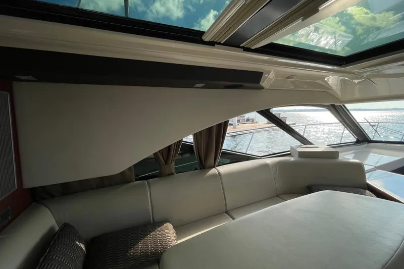 Slide: The Image of Luxurious interior of 2013 Sea Ray 510 Sundancer yacht with waterfront view. - 11