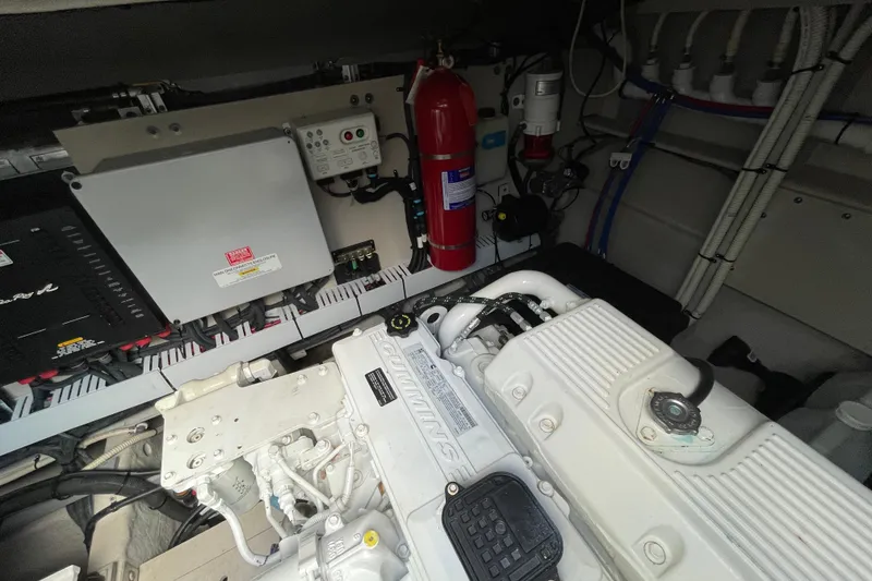 Slide: The Image of Engine room of 2013 Sea Ray 510 Sundancer with Cummins engine and safety equipment. - 12