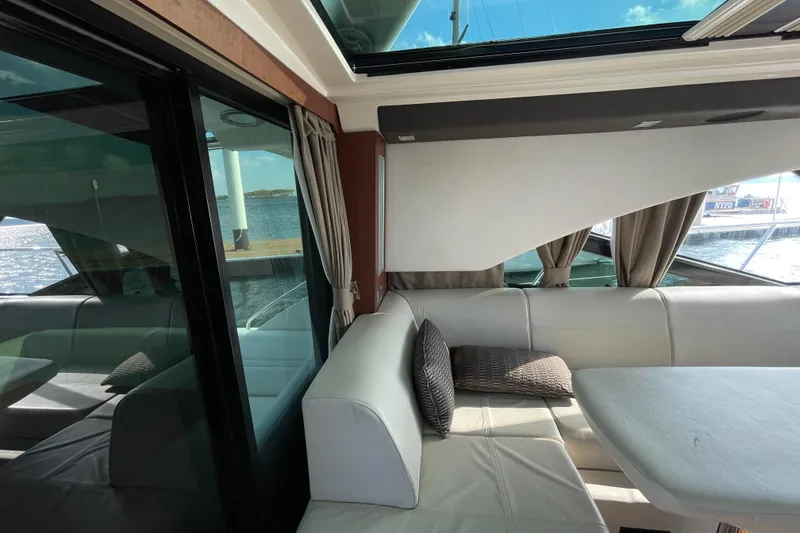 Slide: The Image of Luxurious interior of 2013 Sea Ray 510 Sundancer yacht with elegant seating and scenic views. - 13