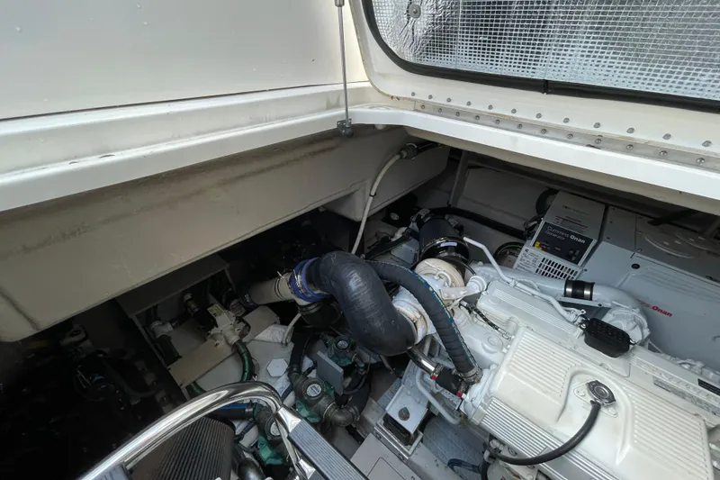 Slide: The Image of Engine compartment of 2013 Sea Ray 510 Sundancer with Cummins Onan generator. - 14