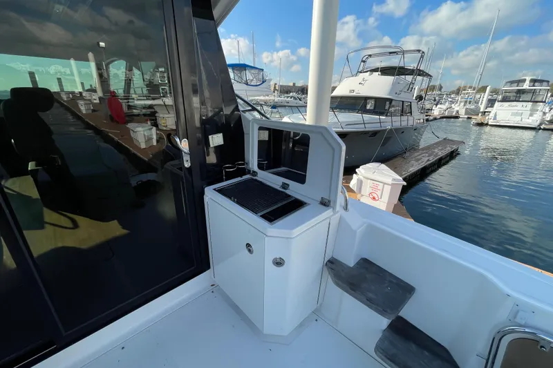 Slide: The Image of 2013 Sea Ray 510 Sundancer yacht with outdoor grill at marina. - 18