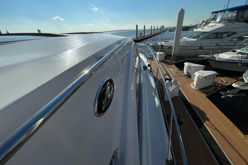 Slide: The Image of 2013 Sea Ray 510 Sundancer yacht docked at marina under clear blue sky. - 21