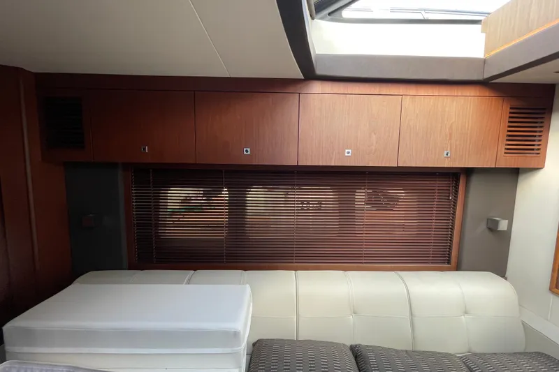 Slide: The Image of Interior of 2013 Sea Ray 510 Sundancer with wooden cabinets and blinds. - 26