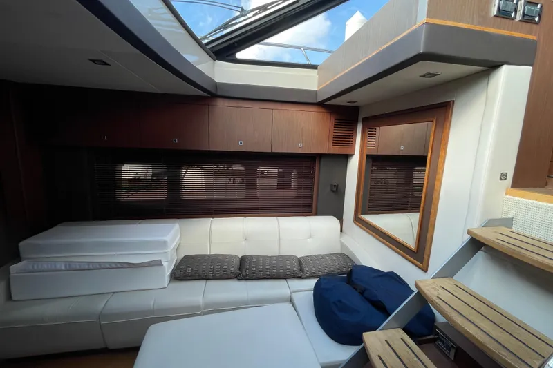 Slide: The Image of Luxurious interior of 2013 Sea Ray 510 Sundancer yacht with modern seating and skylight. - 27