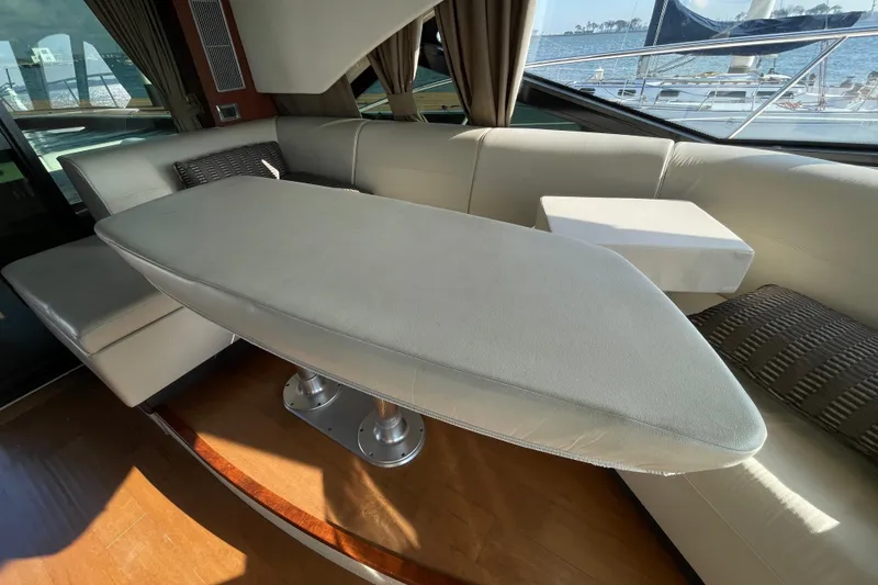 Slide: The Image of Luxurious interior of 2013 Sea Ray 510 Sundancer yacht with elegant seating and table. - 32