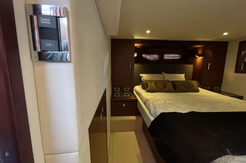 Slide: The Image of Luxurious stateroom interior of 2013 Sea Ray 510 Sundancer yacht with elegant bedding. - 40