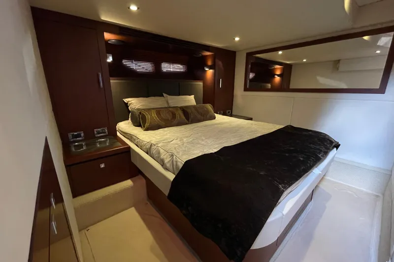 Slide: The Image of Luxurious bedroom interior of 2013 Sea Ray 510 Sundancer yacht with elegant bedding. - 41
