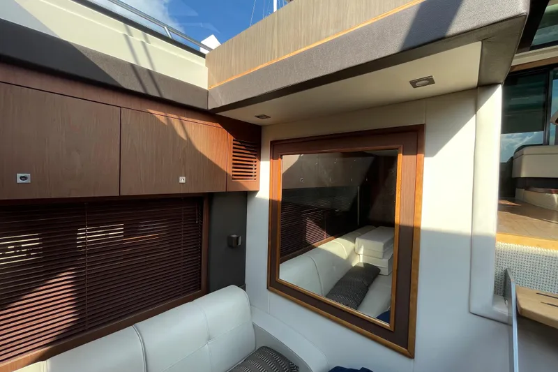 Slide: The Image of Interior of 2013 Sea Ray 510 Sundancer yacht with modern wood and leather design. - 47