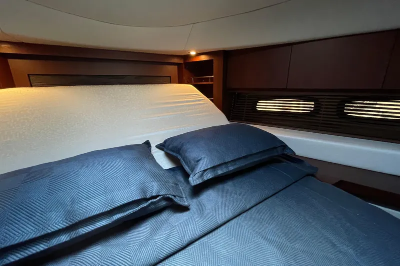 Slide: The Image of Luxurious cabin interior of 2013 Sea Ray 510 Sundancer yacht with elegant bedding. - 51