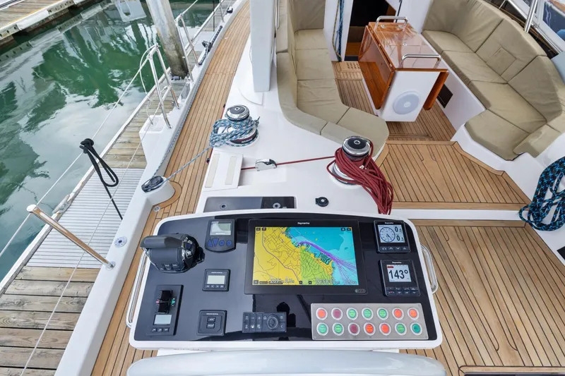 Slide: The Image of Cockpit of 2020 Hylas H57 yacht with navigation controls and seating area. - 27