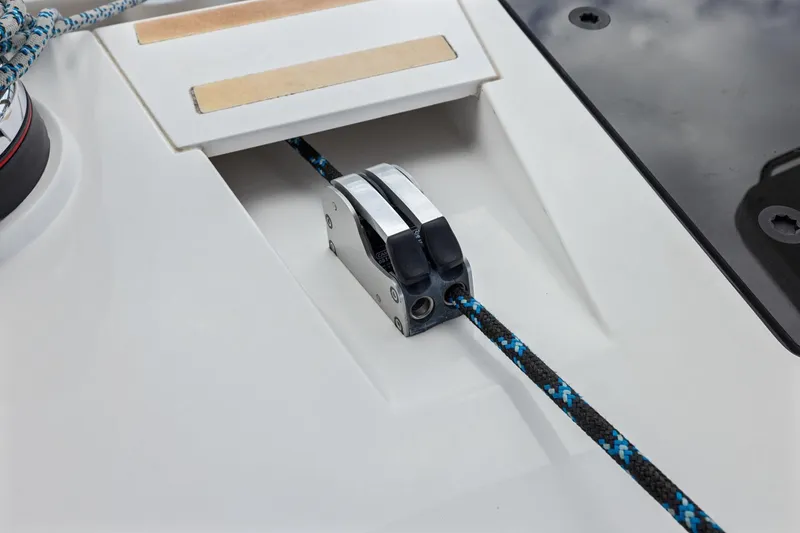 Slide: The Image of Close-up of a 2020 Hylas H57 sailboat deck with rope and cleat. - 32