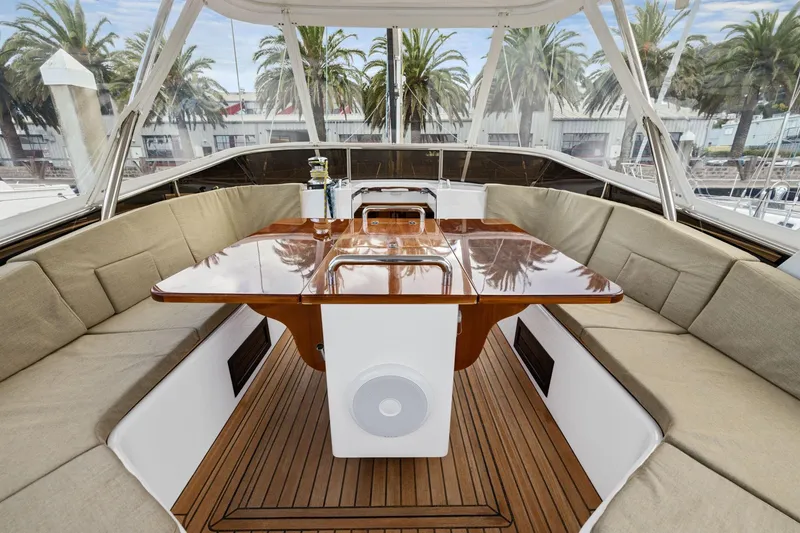 Slide: The Image of Luxurious 2020 Hylas H57 yacht cockpit with elegant wood table and cushioned seating. - 35
