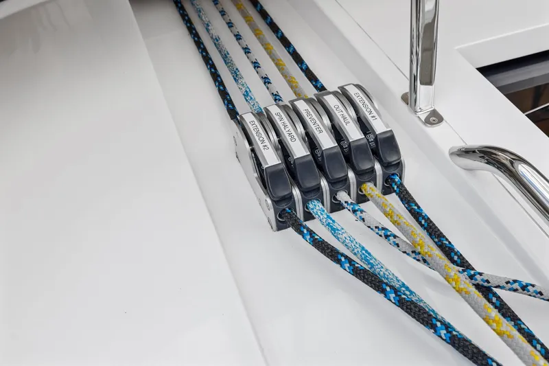 Slide: The Image of Close-up of Hylas H57 2020 sailboat rope clutches with colorful lines. - 37