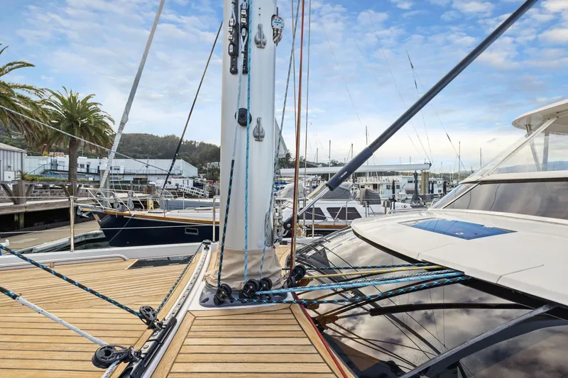 Slide: The Image of 2020 Hylas H57 yacht deck with rigging, docked at marina under blue sky. - 49