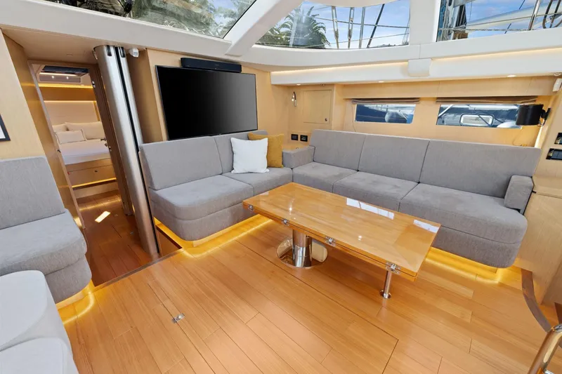 Slide: The Image of Luxurious interior of 2020 Hylas H57 yacht with modern seating and wooden flooring. - 60