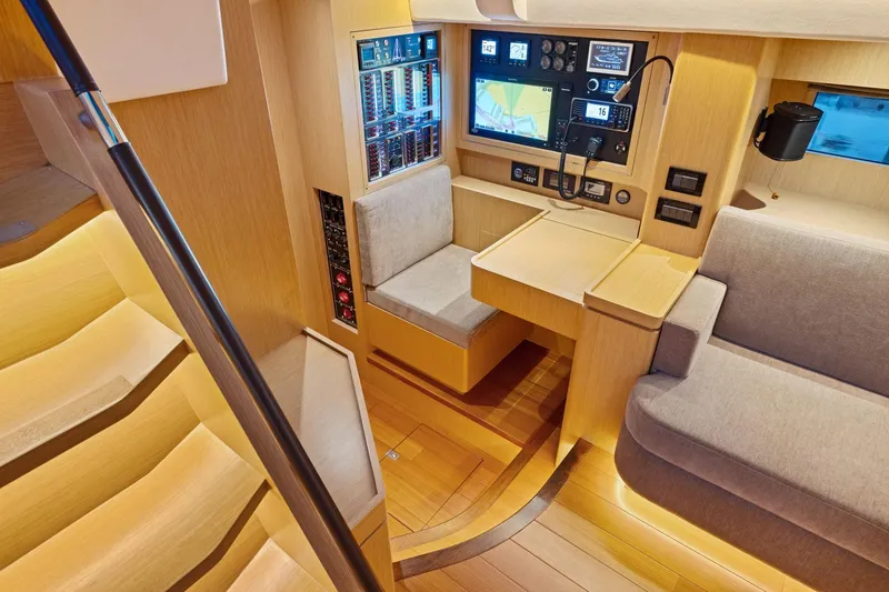 Slide: The Image of Modern navigation station in 2020 Hylas H57 yacht with wood interior and advanced electronics. - 62