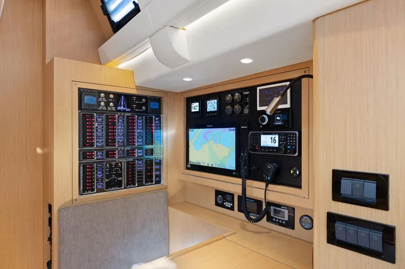 Slide: The Image of Modern navigation and control panel inside 2020 Hylas H57 yacht, featuring advanced electronics. - 64