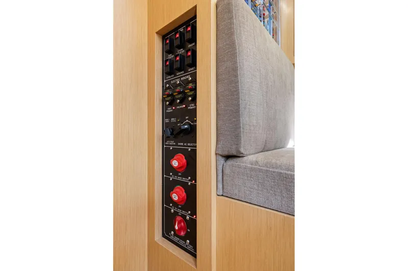 Slide: The Image of Electrical panel on a 2020 Hylas H57 yacht, featuring switches and controls. - 65