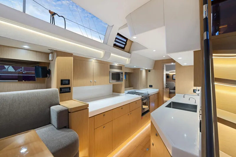 Slide: The Image of Luxurious interior of 2020 Hylas H57 yacht featuring modern kitchen and seating area. - 67