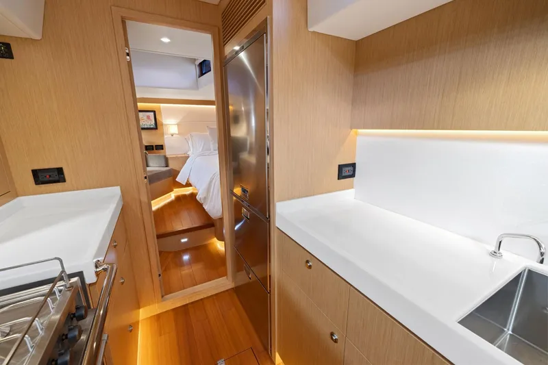 Slide: The Image of Modern interior of 2020 Hylas H57 yacht, featuring sleek kitchen and cozy bedroom. - 76