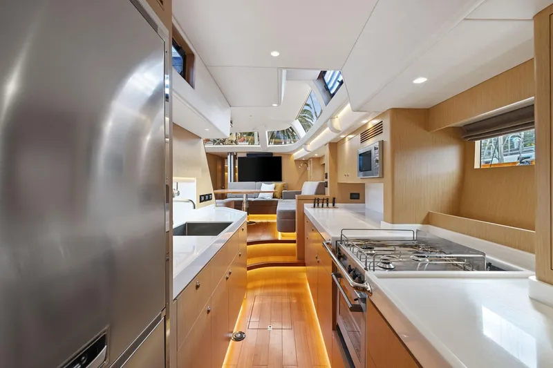Slide: The Image of Luxurious interior of 2020 Hylas H57 yacht featuring modern kitchen and seating area. - 77