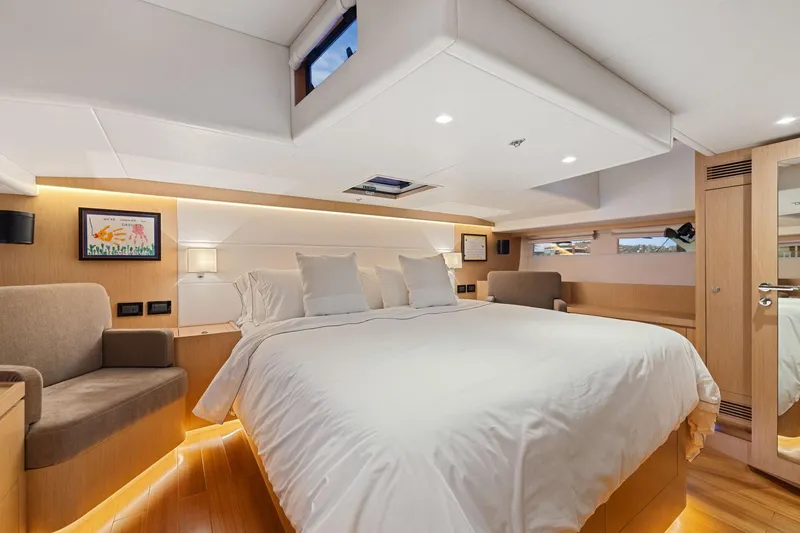 Slide: The Image of Luxurious 2020 Hylas H57 yacht bedroom with modern design and cozy ambiance. - 78
