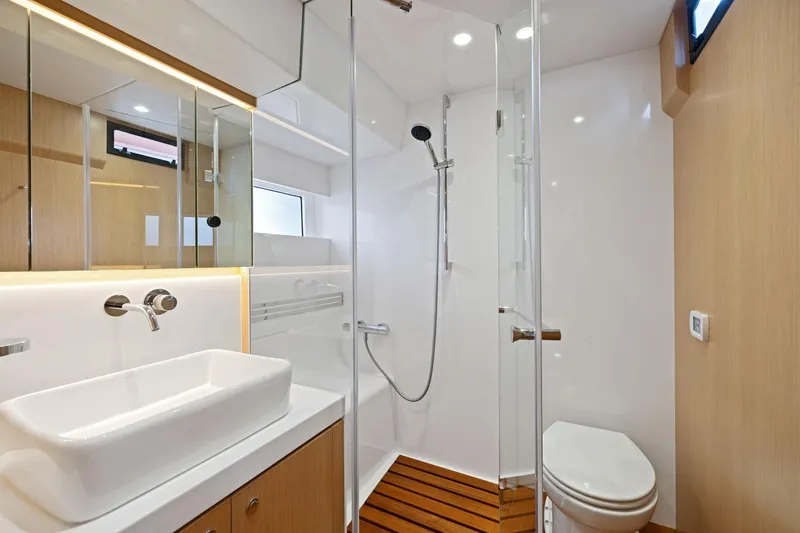 Slide: The Image of Modern bathroom in 2020 Hylas H57 yacht with sleek fixtures and wooden accents. - 84