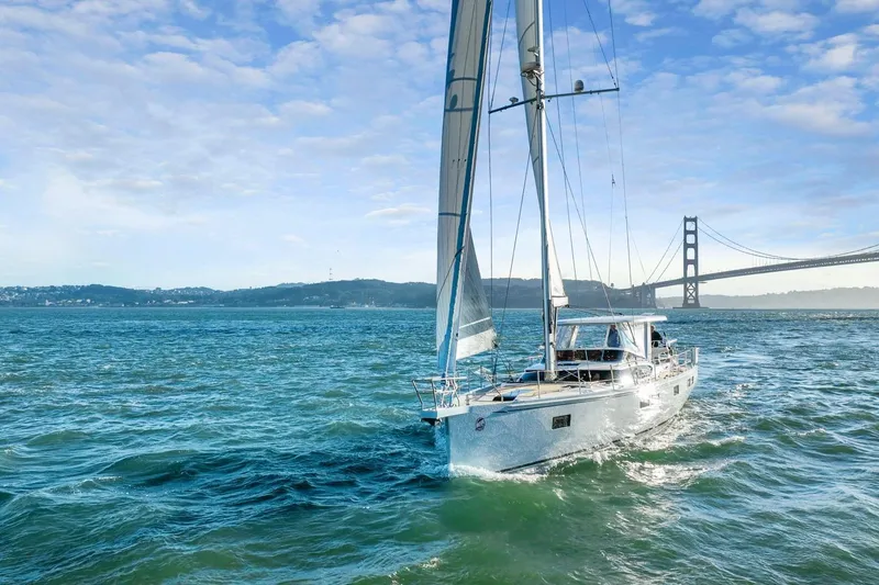 Slide: The Image of Sailing yacht Hylas H57 (2020) cruising near a bridge on a sunny day. - 15
