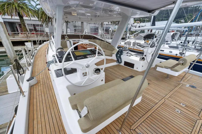 Slide: The Image of Luxurious 2020 Hylas H57 yacht deck with modern steering and seating area. - 21