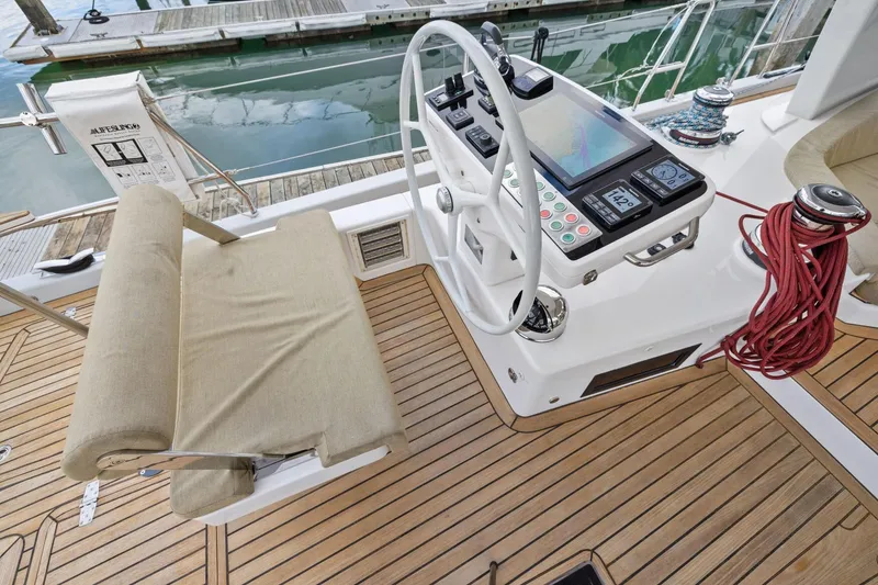 Slide: The Image of Helm station of 2020 Hylas H57 yacht with navigation controls and teak decking. - 24