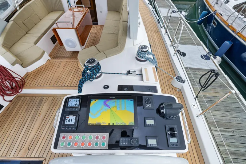 Slide: The Image of Cockpit of 2020 Hylas H57 yacht with navigation controls and seating area. - 25