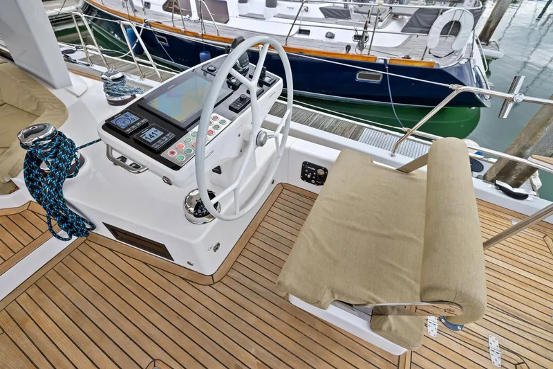 Slide: The Image of Helm station of 2020 Hylas H57 yacht with navigation equipment and teak decking. - 26