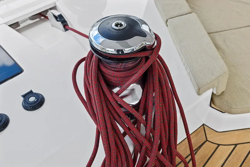 Slide: The Image of Red rope on winch aboard 2020 Hylas H57 yacht, with teak deck and beige seating. - 31