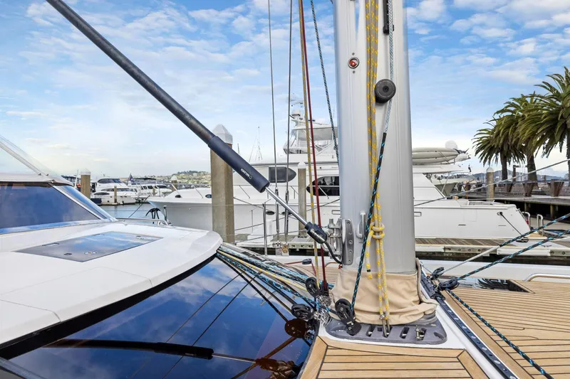 Slide: The Image of 2020 Hylas H57 yacht deck with mast, docked at marina under blue sky. - 44