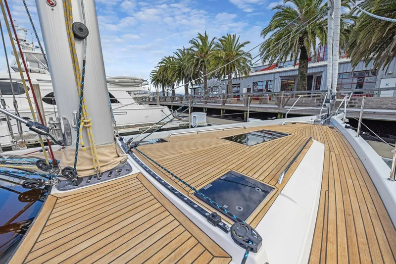 Slide: The Image of Deck of 2020 Hylas H57 yacht with teak finish, docked near palm trees. - 45