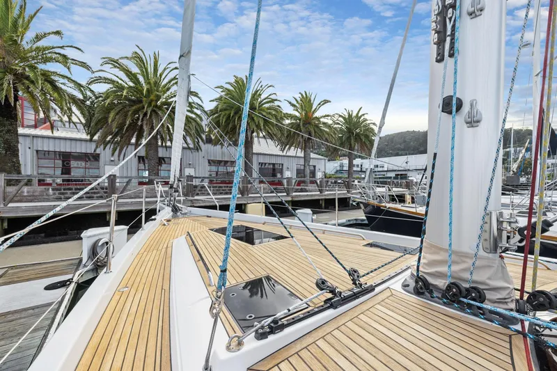 Slide: The Image of Deck view of 2020 Hylas H57 yacht docked near palm trees and marina. - 50