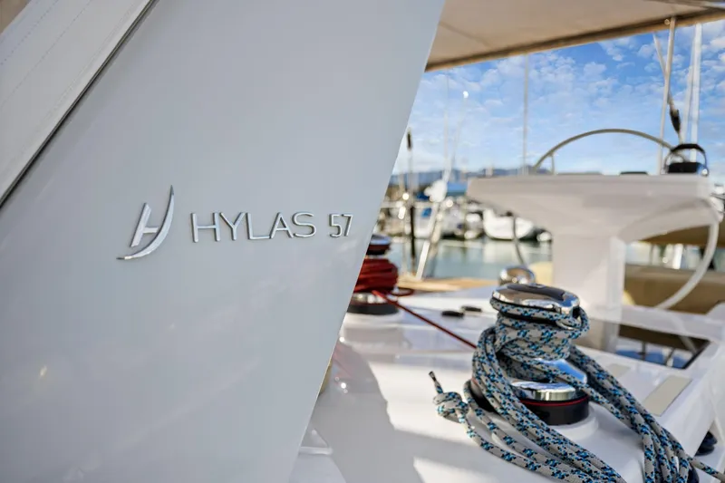 Slide: The Image of 2020 Hylas H57 yacht deck with ropes and steering wheel in marina. - 55