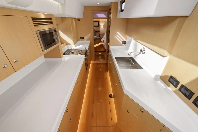 Slide: The Image of Modern galley kitchen in 2020 Hylas H57 yacht with sleek countertops and appliances. - 70