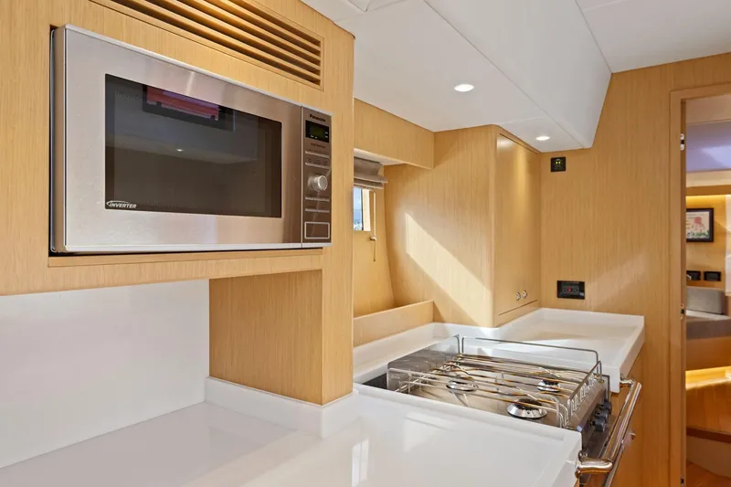 Slide: The Image of Modern kitchen in 2020 Hylas H57 yacht with microwave and stove. - 74