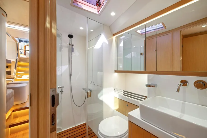 Slide: The Image of Luxurious bathroom interior of 2020 Hylas H57 yacht with modern fixtures and wooden accents. - 89