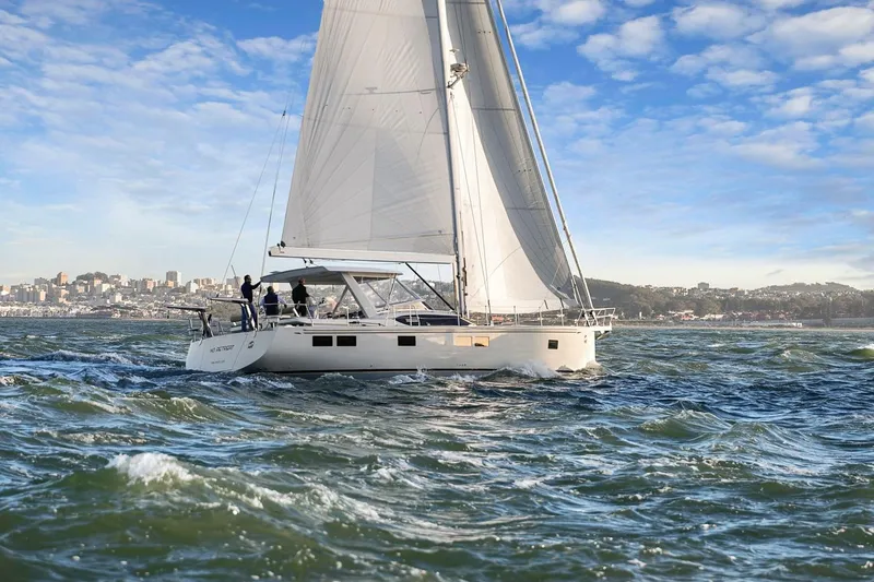 Slide: The Image of 2020 Hylas H57 sailboat navigating ocean waves under a clear blue sky. - 9